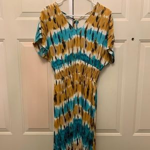 Adorable summer dress!  T-length, elastic waist and back tie.